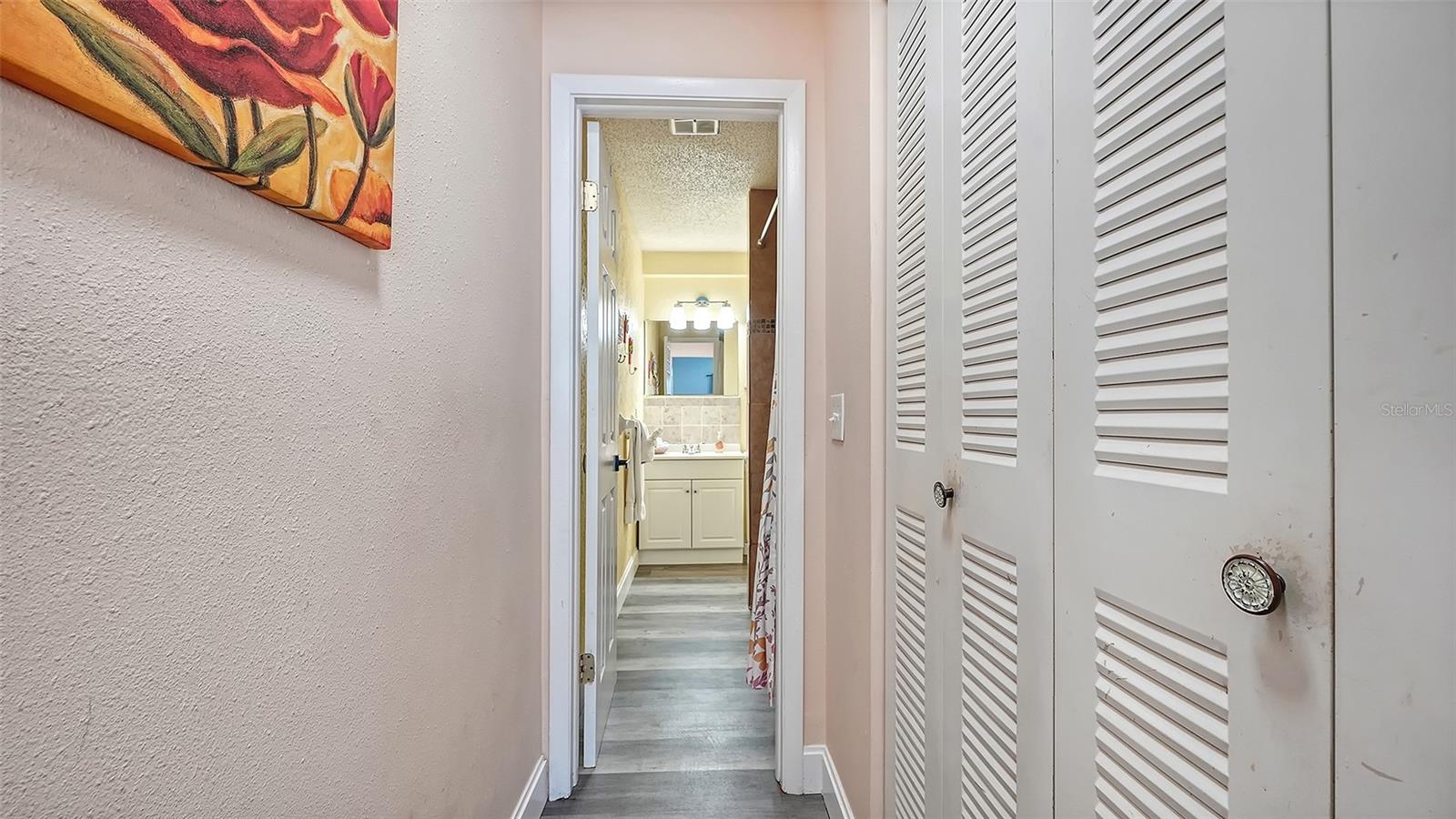 Unit B, hallway from bedroom to bathroom.