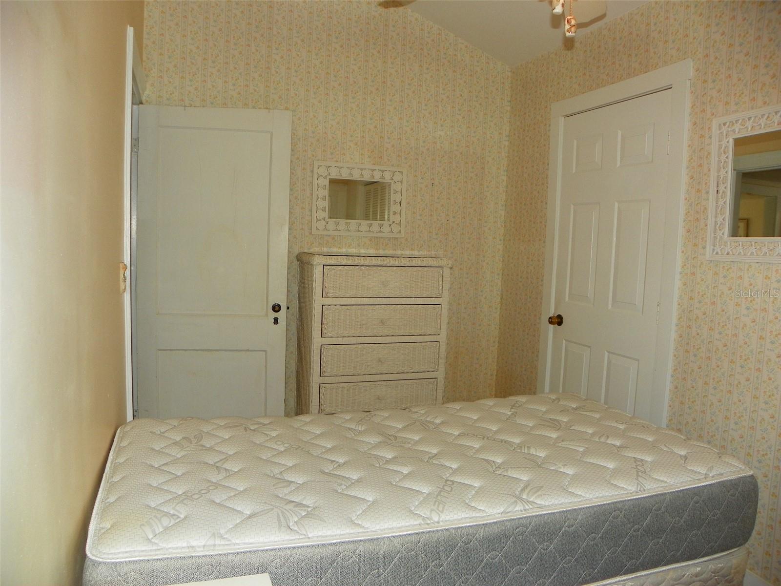From Bedroom 1, door on right leads to storage/laundry area.