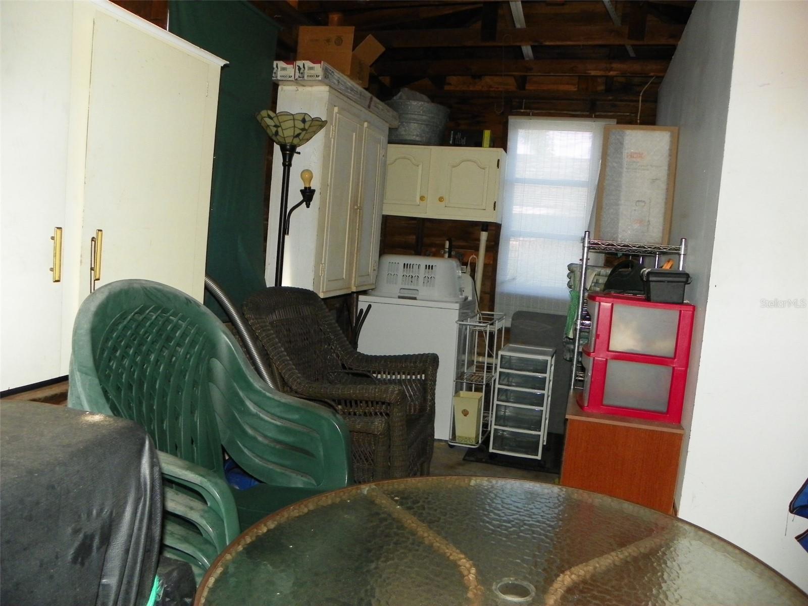 Storage area with washer.