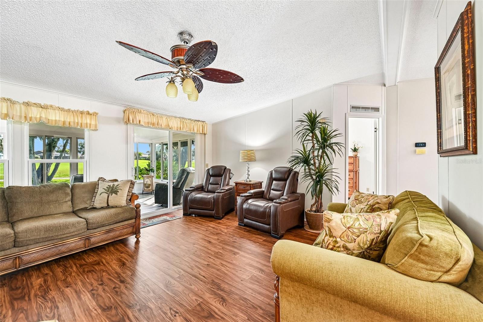 Partial View of Back Lanai and Golf Course from Spacious Living Room