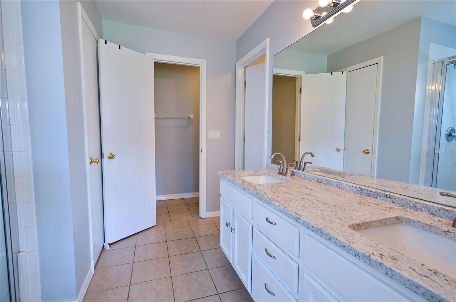 Master bath with walk in shower and walk in closet