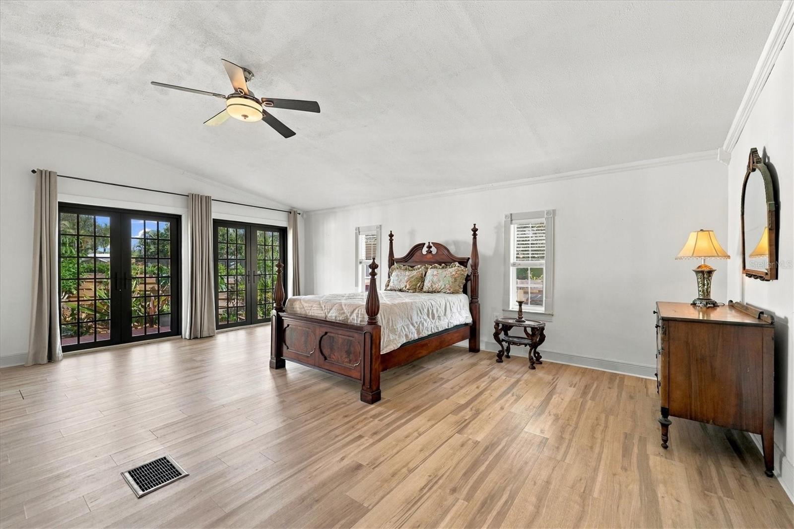 Primary Bedroom with french doors to the outdoor patio