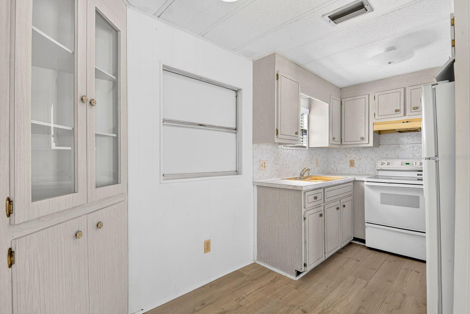 Dining/kitchen combo featuring built in cabinet