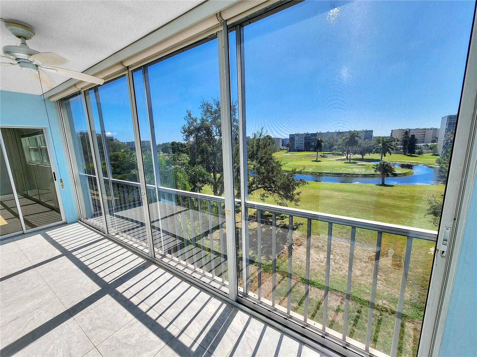 Balcony with golf course view. Door to primary bedroom