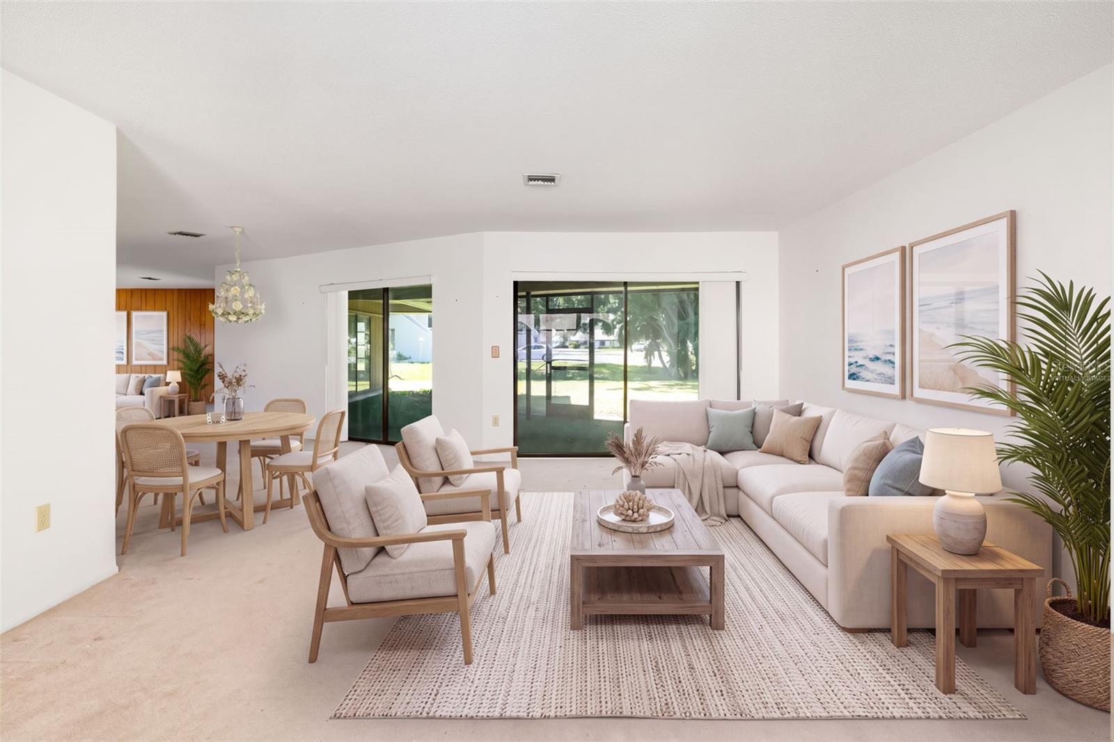 Virtually Staged. Spacious living and dining area with sliders to the screened lanai. Virtually Staged. Spacious living and dining area with sliders to the screened lanai.