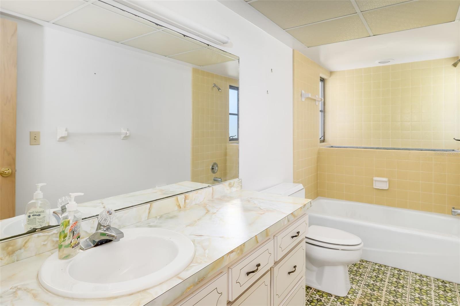 Full guest bath with tub and shower, ready to personalize.