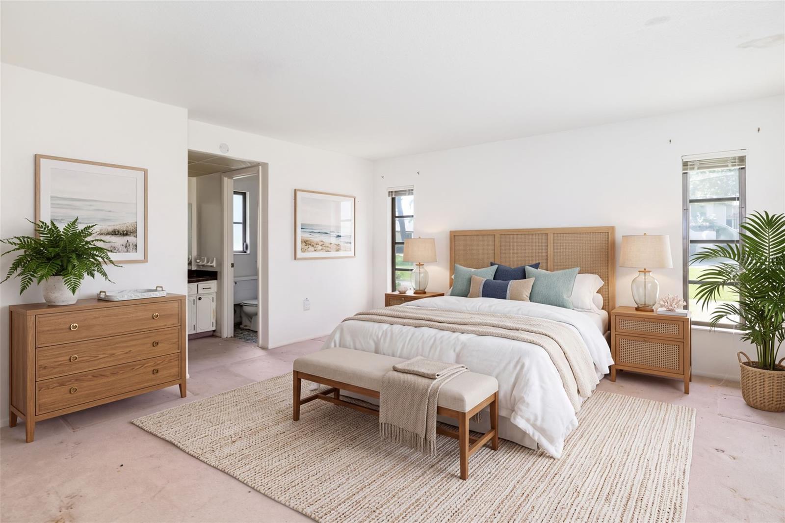 Virtually Staged. Primary suite set apart from the guest bedrooms in a split floor plan.