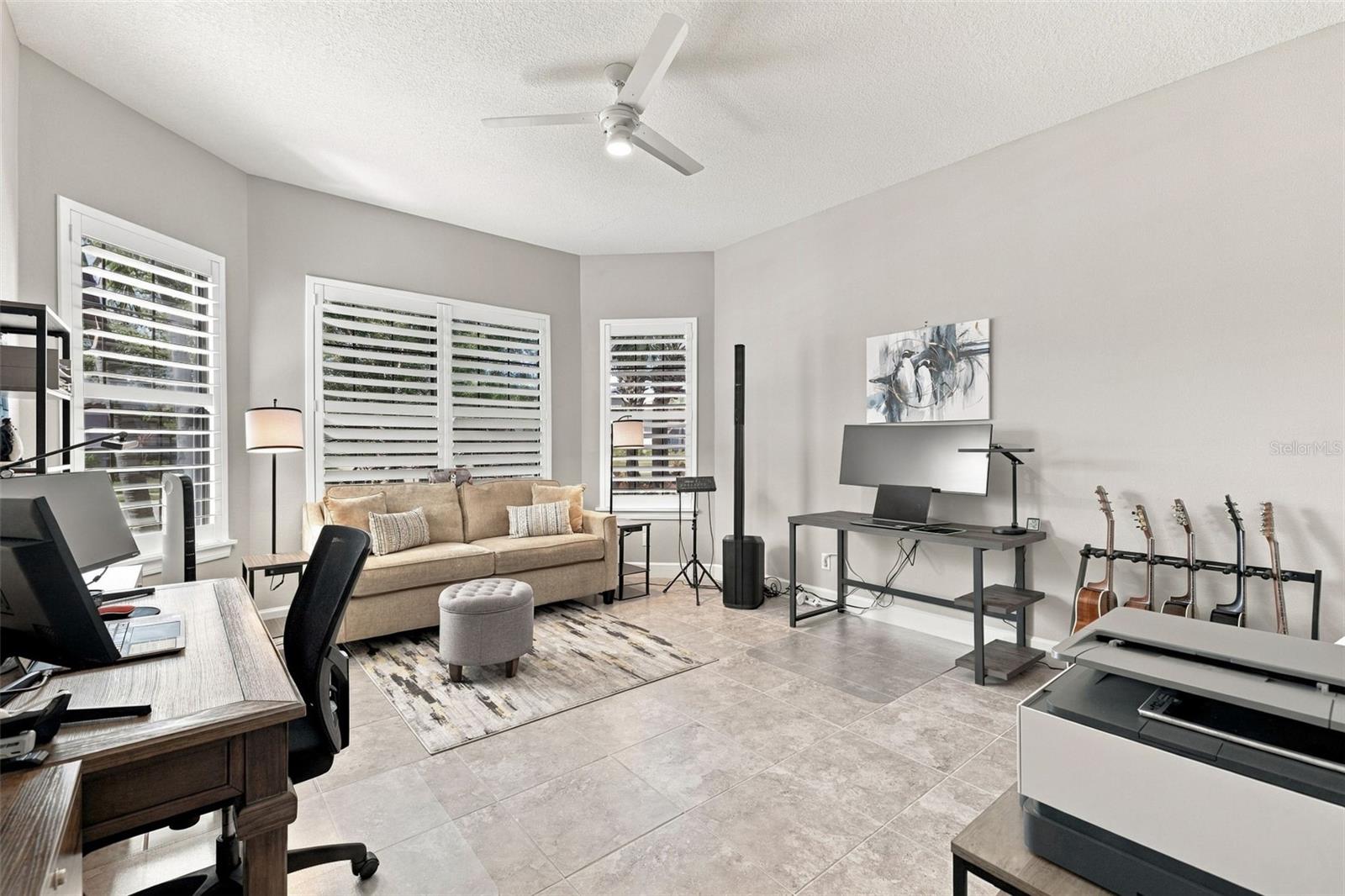 Large front Bedroom with bay window being used as an office and music room