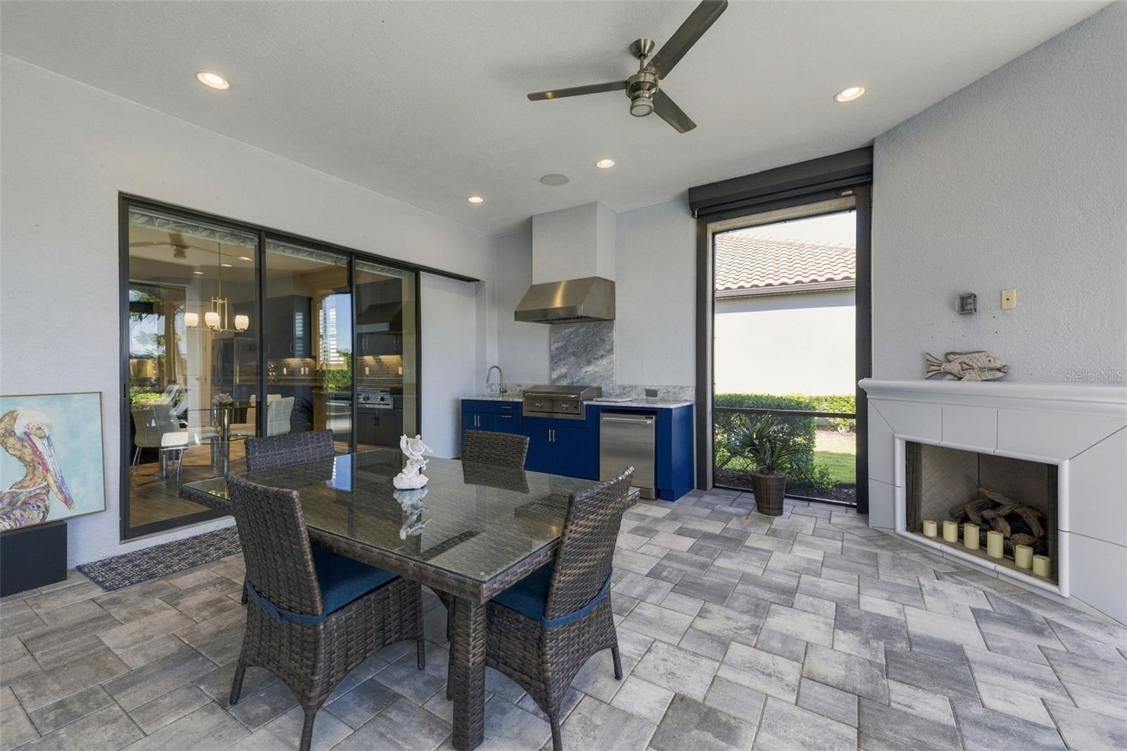 Outdoor Kitchen and Dining with a Fireplace