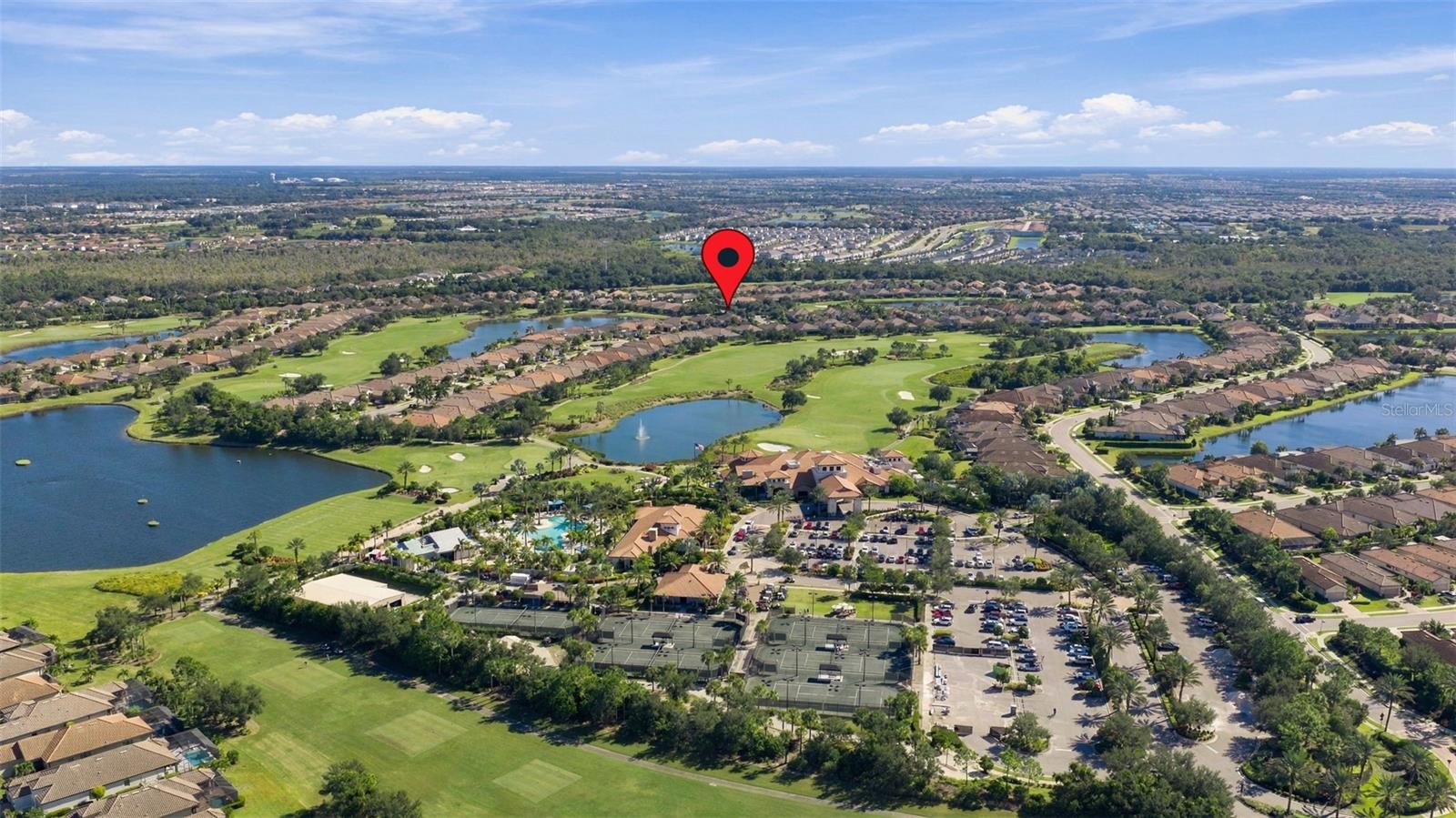 Culinary Center, Wellness Center, Tennis Courts and Resort Pool with tiki in foreground