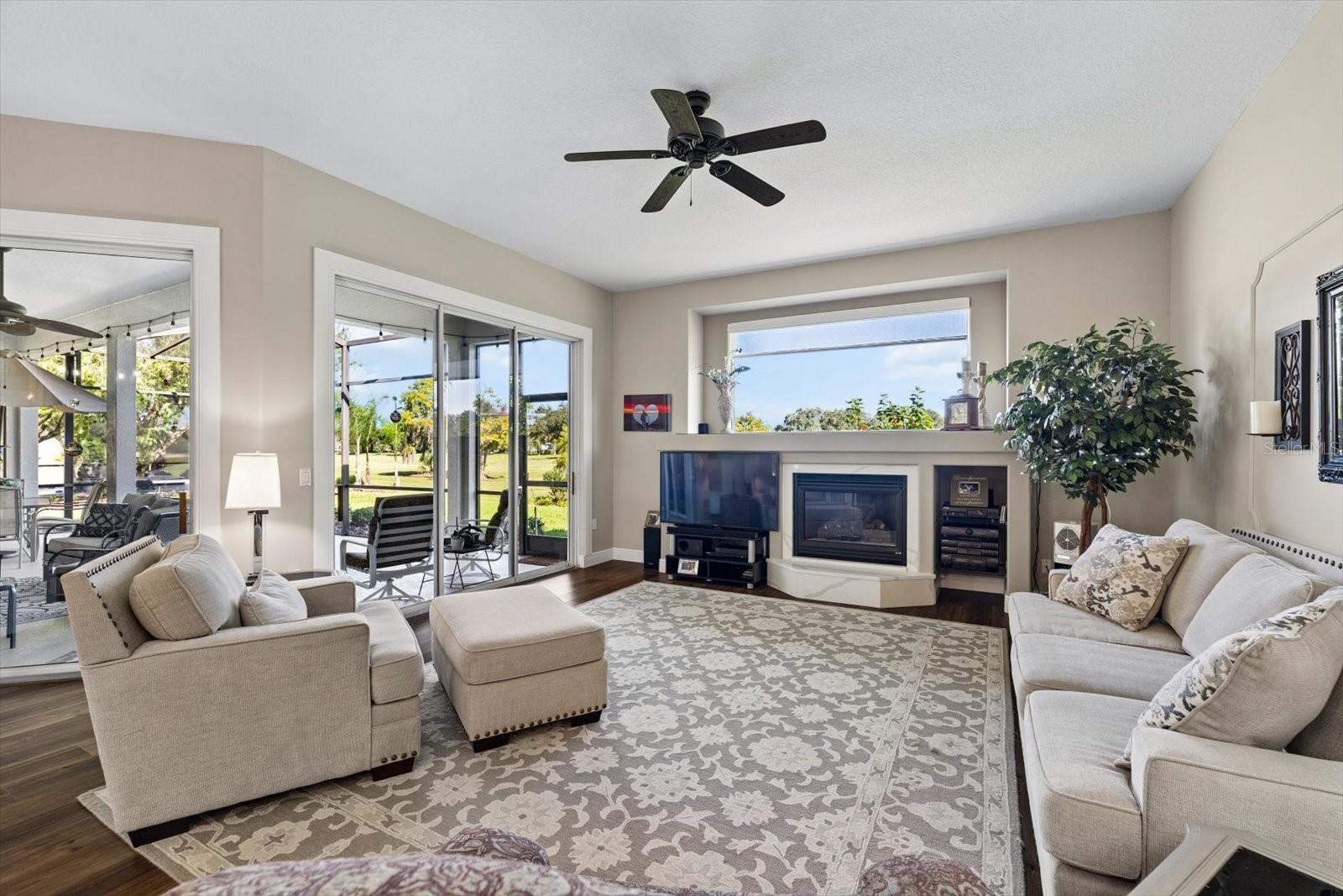 Family room with 2 sets of sliders providing that indoor outdoor Florida lifestyle