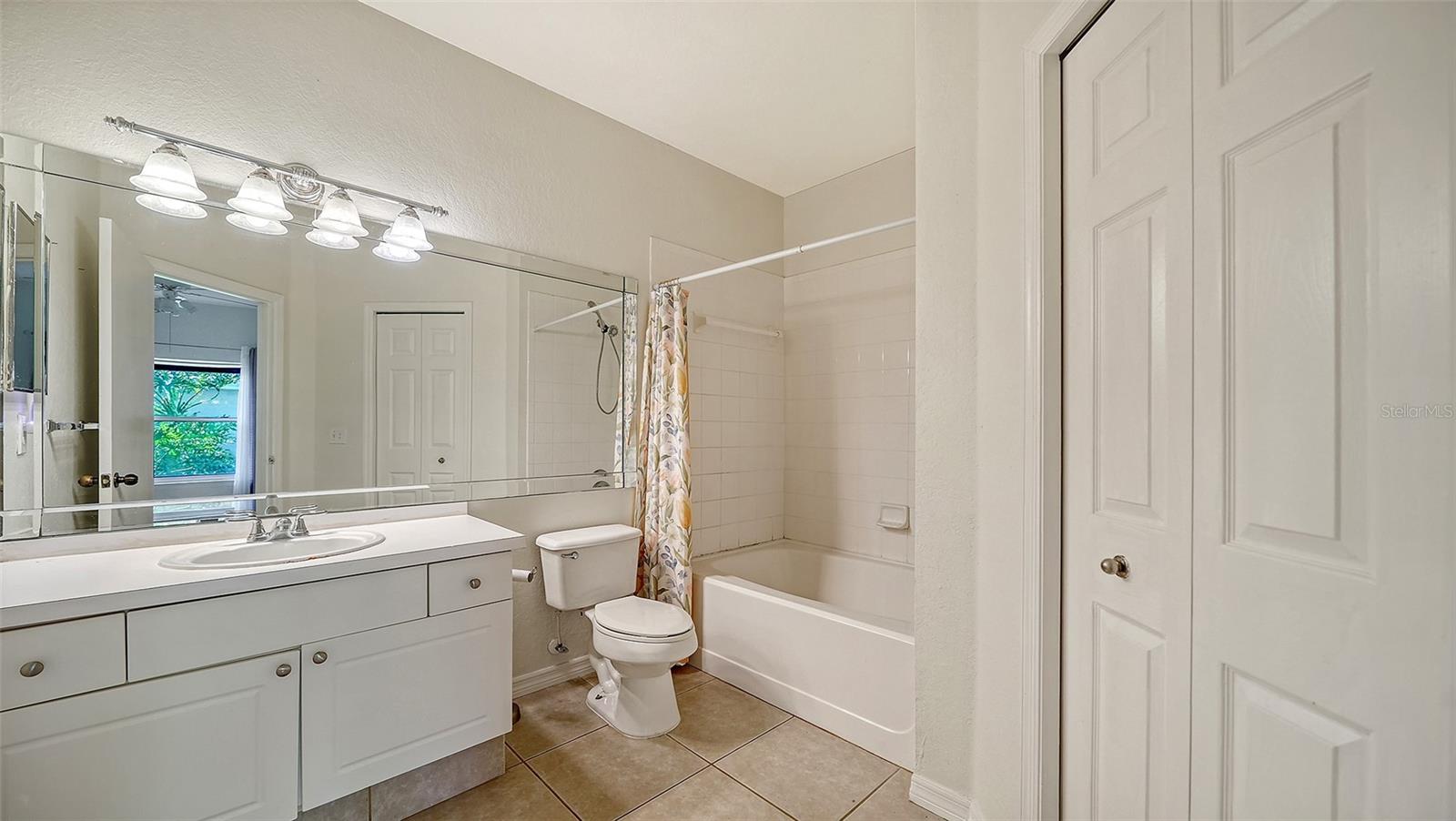 MASTER BATHROOM WITH LINEN CLOSET