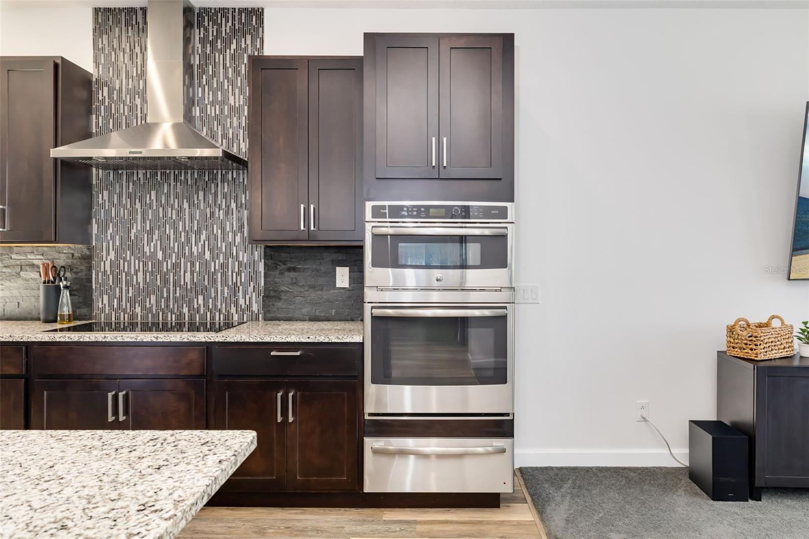 Induction Cooktop, Overhead Exhaust, Dual Oven/Microwave, and Warming Drawer