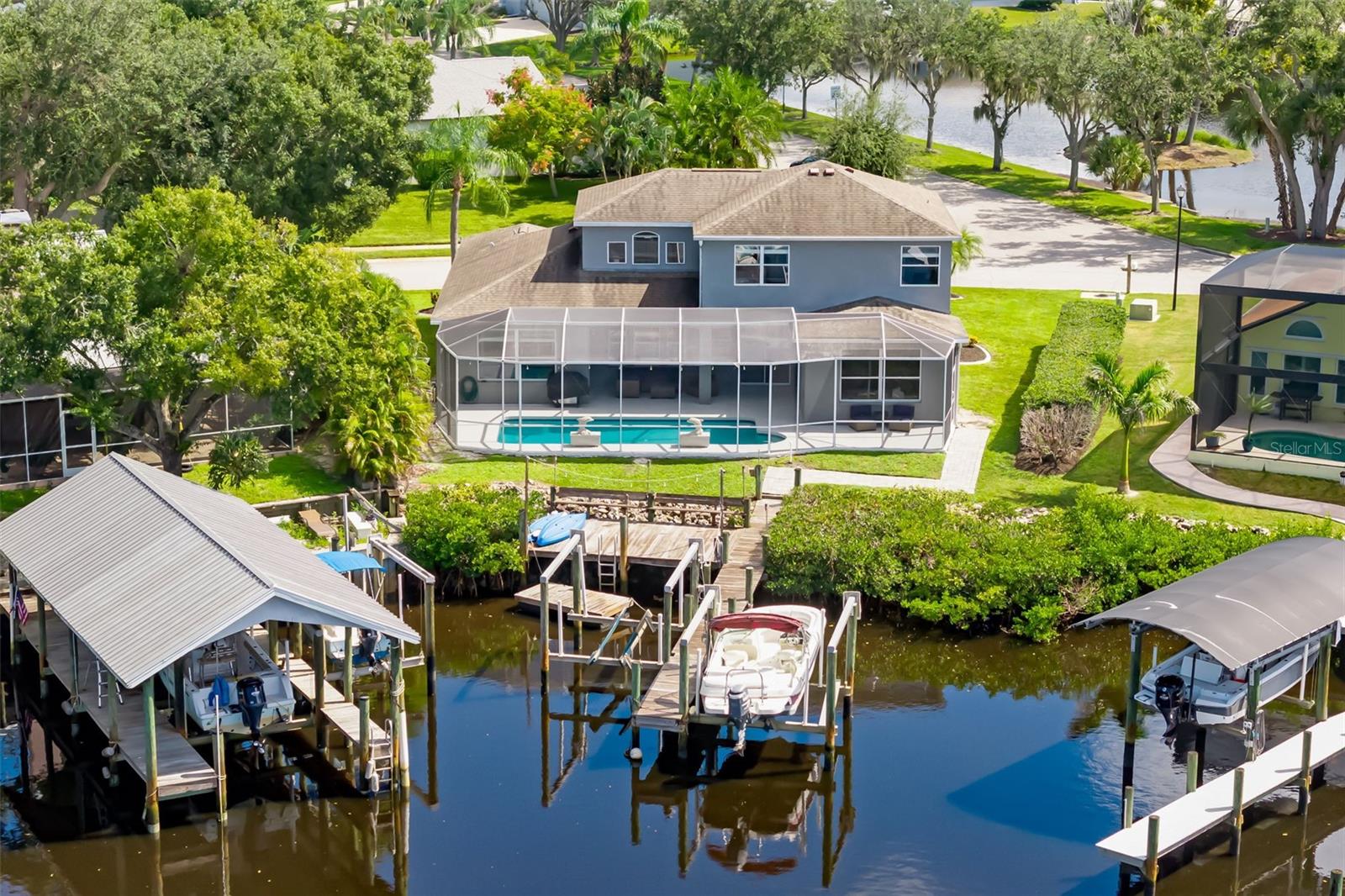 Back Elevation - Culdesac on Canal - Two Boat lifts and a floating dock for accessing Kayaks Back Elevation - Culdesac on Canal - Two Boat lifts and a floating dock for accessing Kayaks