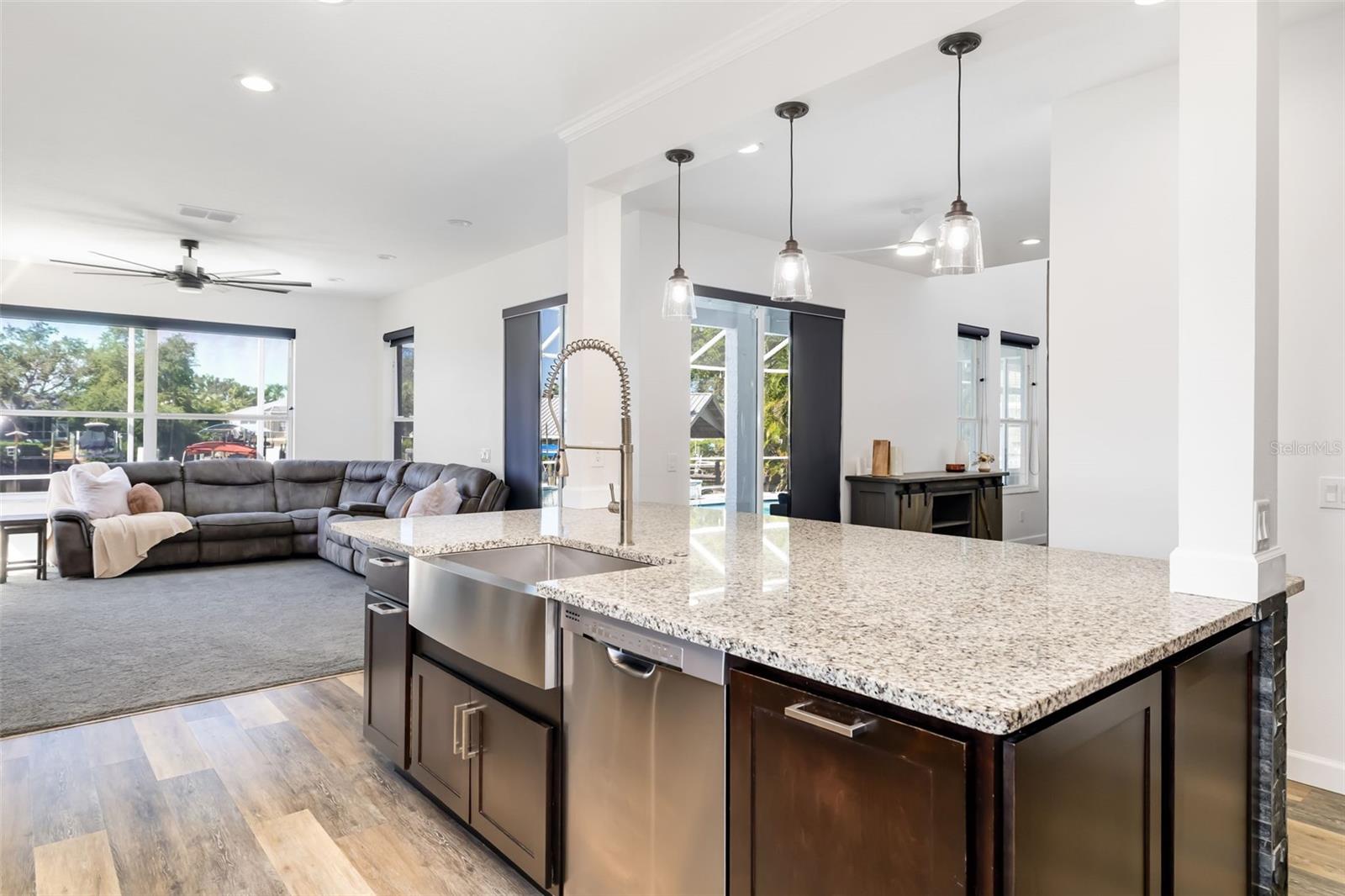 Island Kitchen, separate dual trash cans - recycling on far left/trash on far right.  Additional cabinets storage on end of both sides of Island