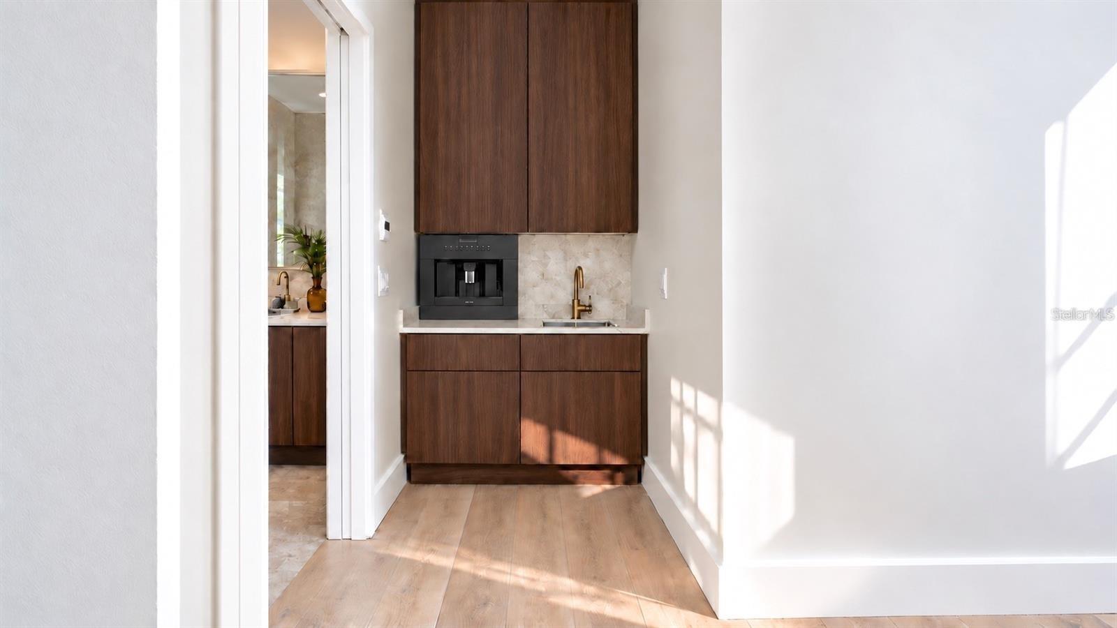 Wet bar for the primary bedroom, with virtual staging.