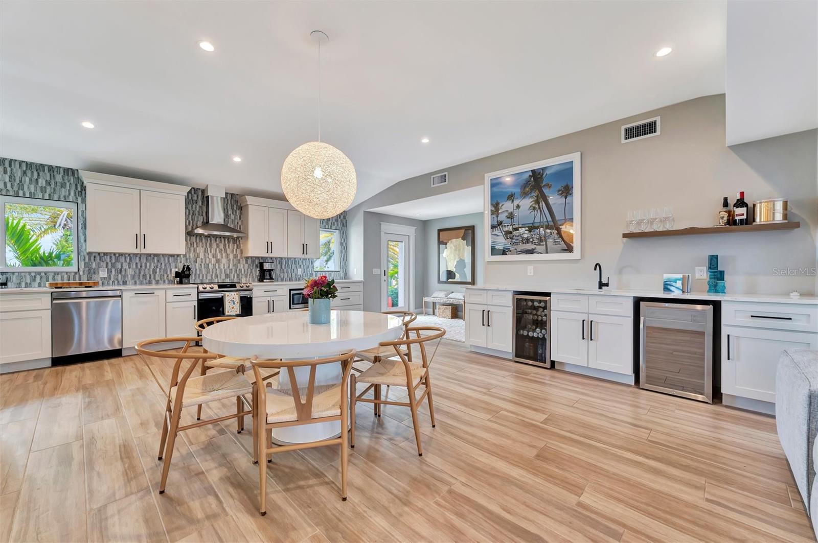 Chef-inspired kitchen with quality appliances, wine and beverage refrigerators, and wet bar.