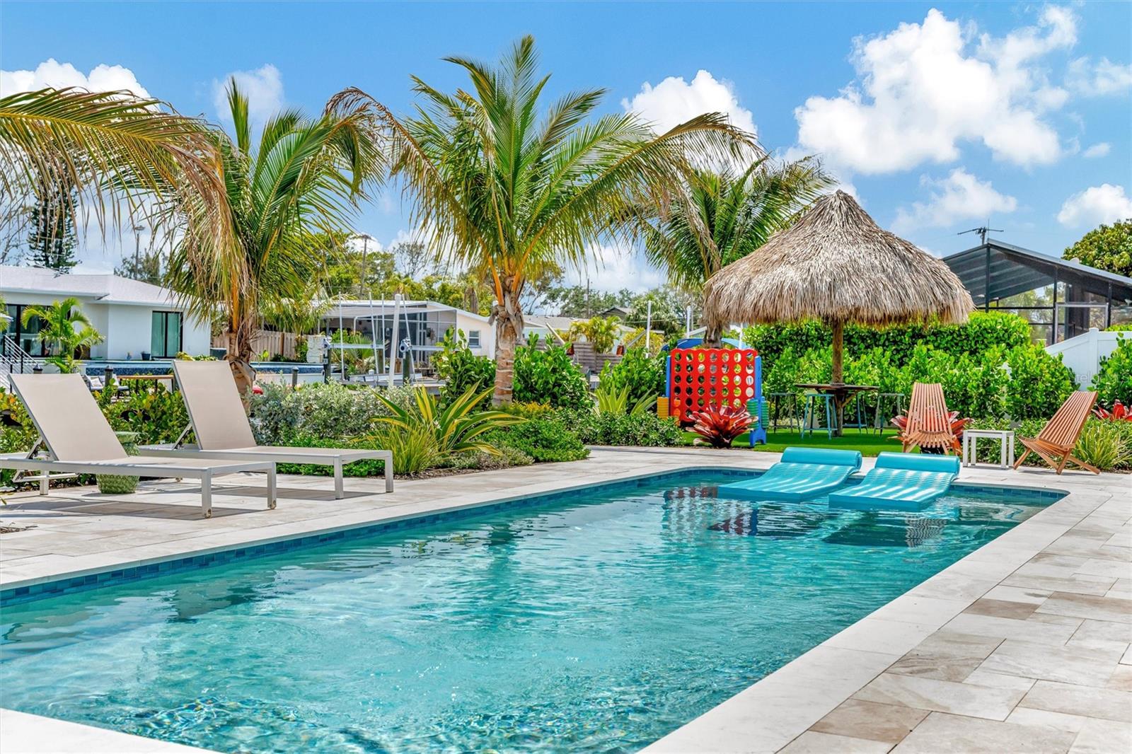 Approximately 90 feet of waterfront, updated seawall, composite dock, floating kayak/paddleboard dock, and covered 10,000-lb remote boat lift. Approximately 90 feet of waterfront, updated seawall, composite dock, floating kayak/paddleboard dock, and covered 10,000-lb remote boat lift.