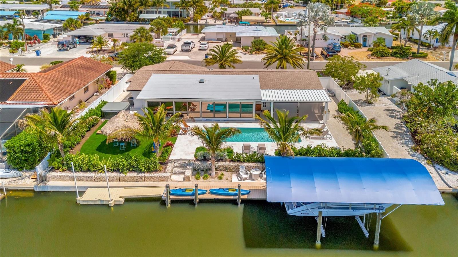Extensively updated with 2023 roof, 2022 AC, newer rear windows, flood barriers, wood-look tile, neutral finishes, and open living/dining area. Extensively updated with 2023 roof, 2022 AC, newer rear windows, flood barriers, wood-look tile, neutral finishes, and open living/dining area.