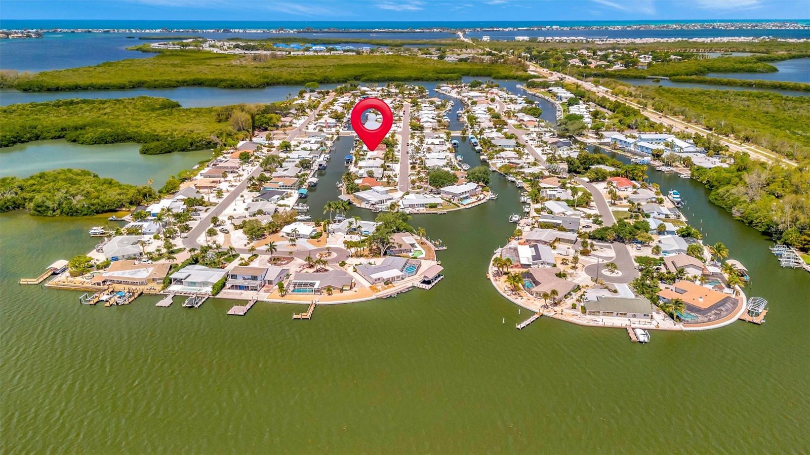 Approximately 90 feet of waterfront, updated seawall, composite dock, floating kayak/paddleboard dock, and covered 10,000-lb remote boat lift. Approximately 90 feet of waterfront, updated seawall, composite dock, floating kayak/paddleboard dock, and covered 10,000-lb remote boat lift.