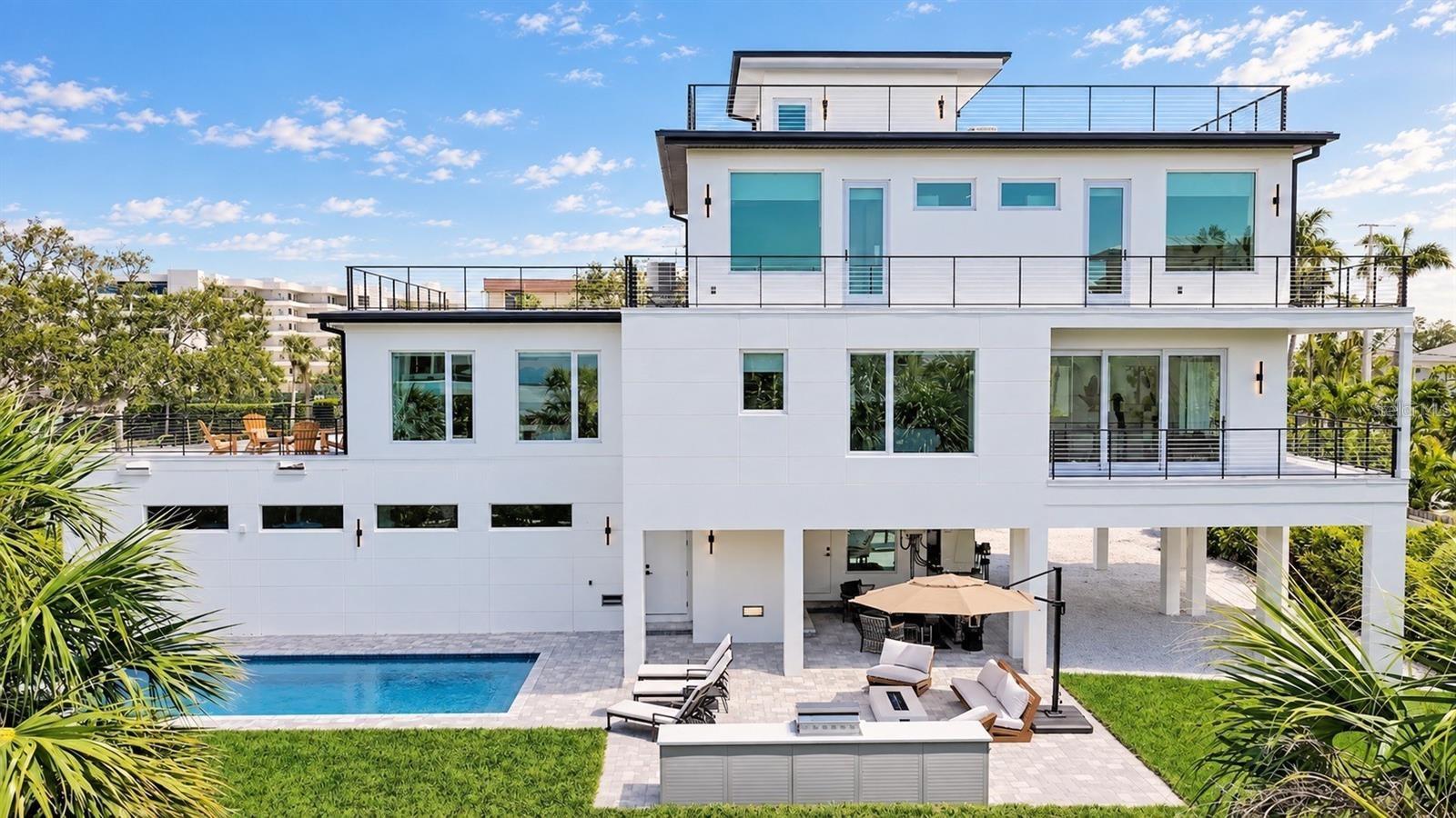 Full outdoor kitchen and heated salt water pool with hot tub spa