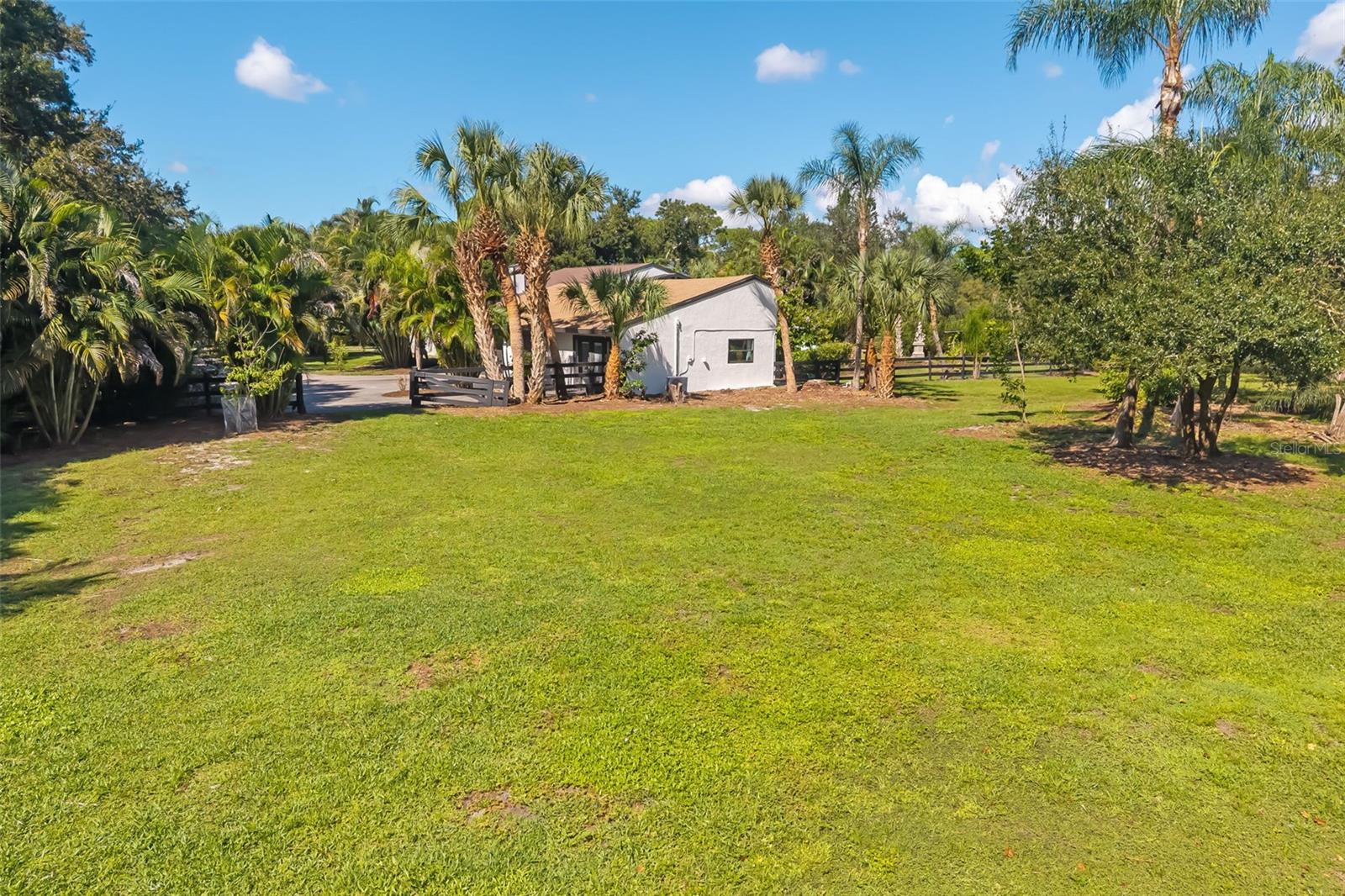 Imagine the possibilities: ample open space for a future RV, boat or collector-car garage, workshop, barn or other accessory structure, subject to Pine Ranch and Sarasota County requirements.