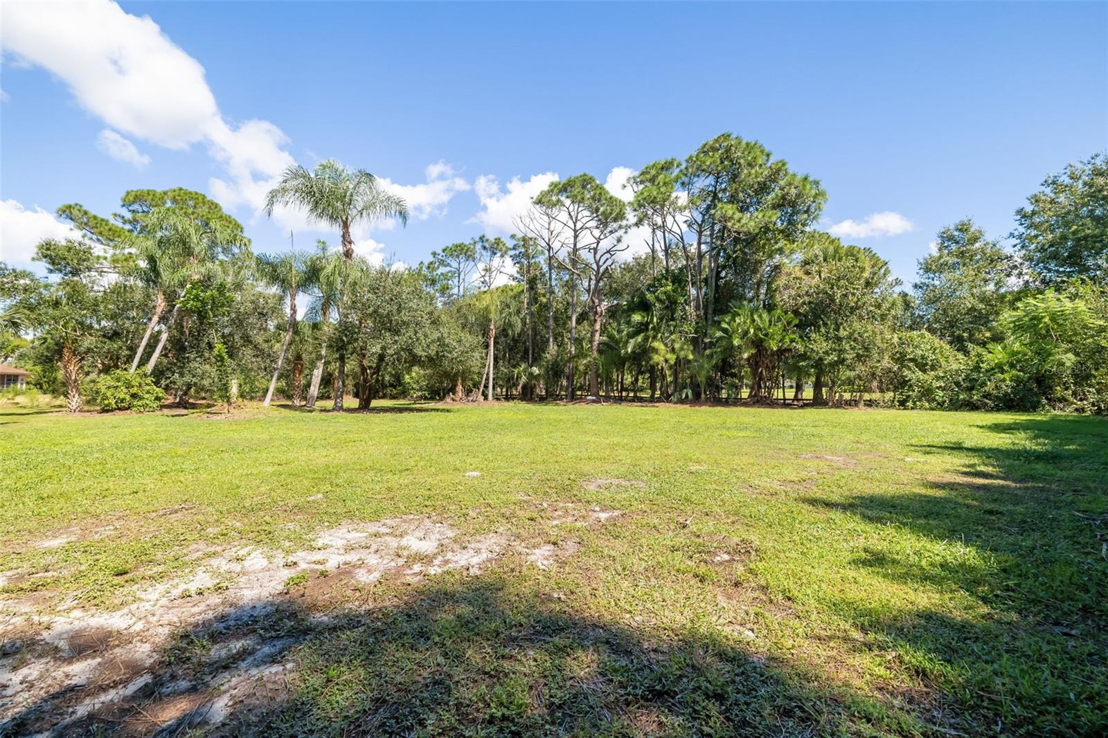 Expansive open acreage offering potential for a future RV/boat garage, collector-car garage, workshop, barn or other accessory structure, subject to applicable approvals.