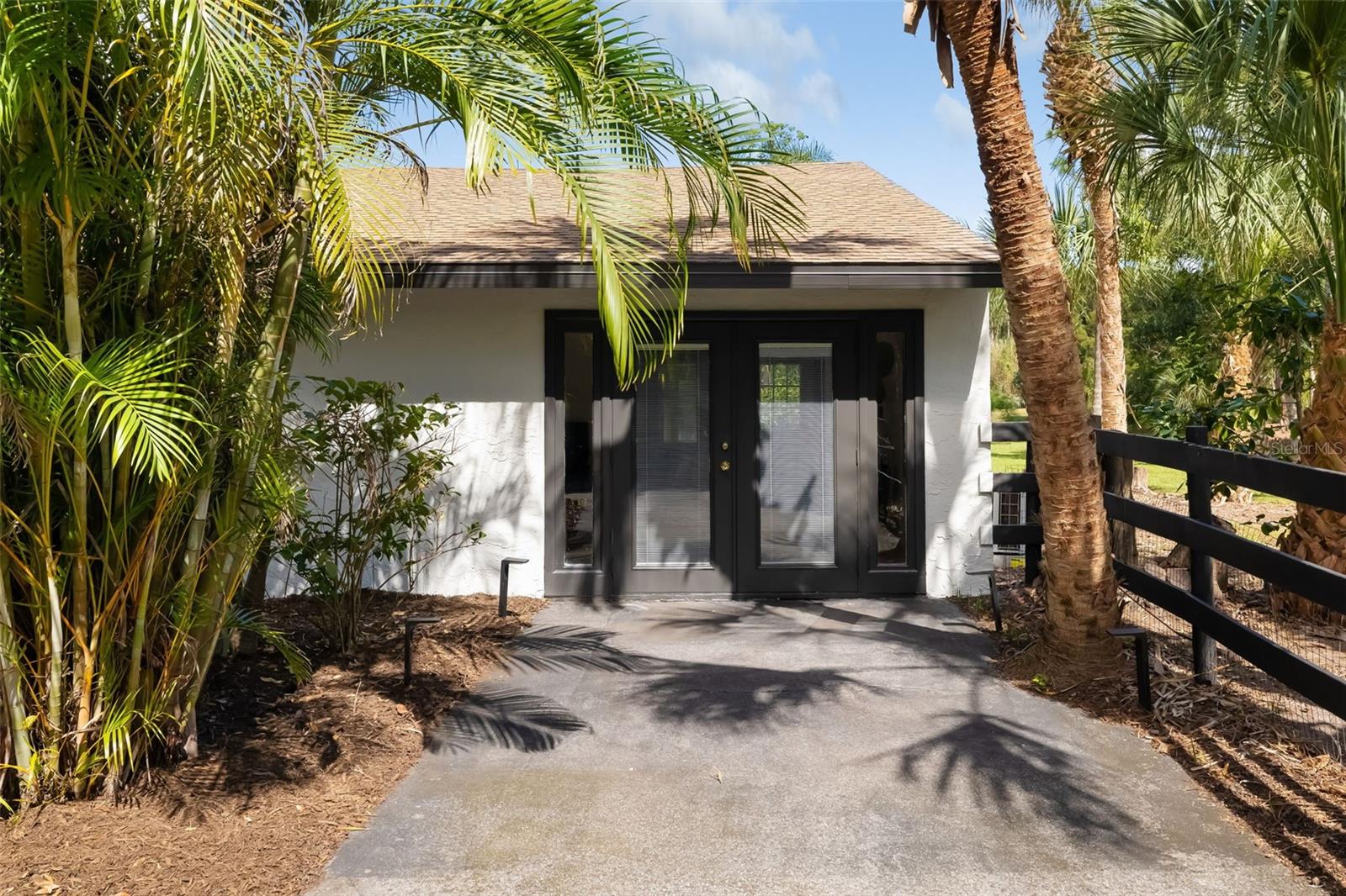 A private exterior entrance enhances the versatility of this additional bedroom, bath and living areawell suited for guests, extended family, an in-law-style retreat, office or multigenerational living.