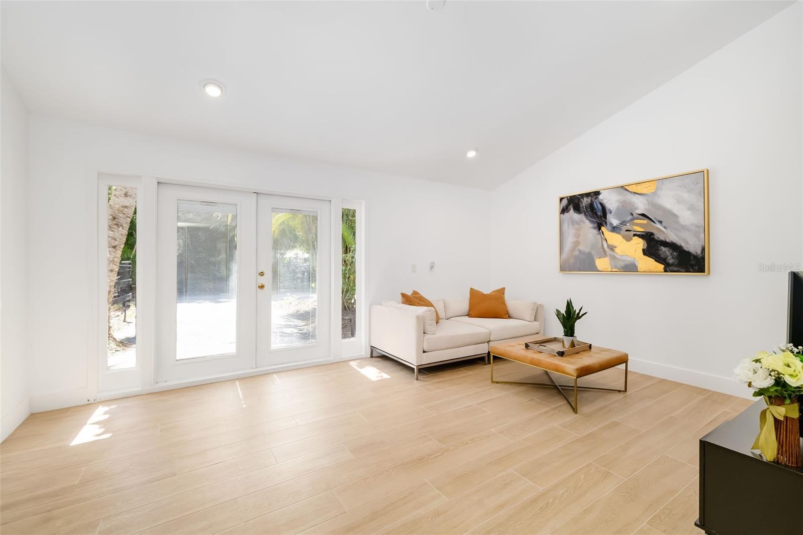 Bright, flexible living area with exterior accessan excellent complement to the adjoining bedroom and bath for guests or extended family.