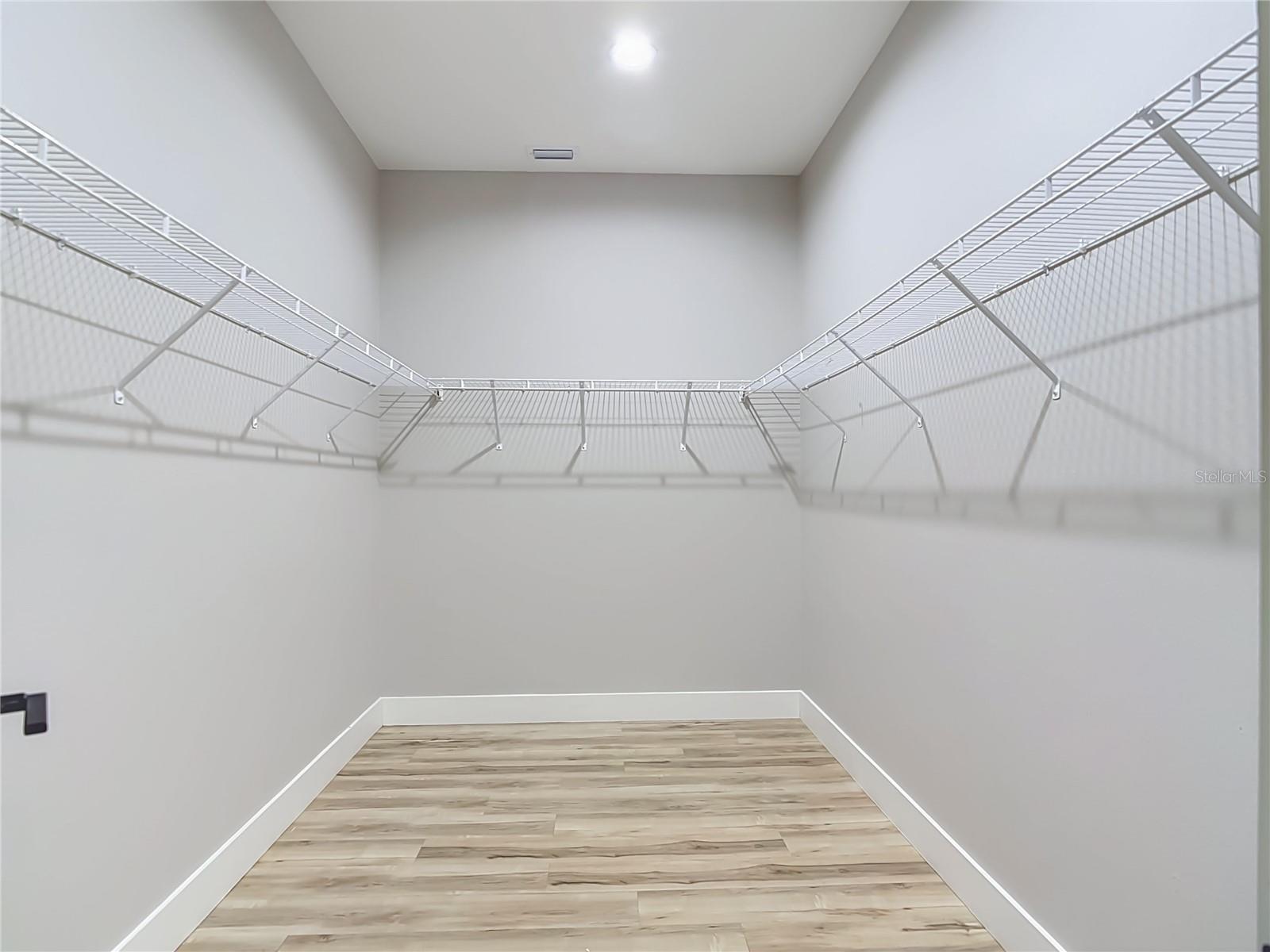 walk in closet in primary bedroom
