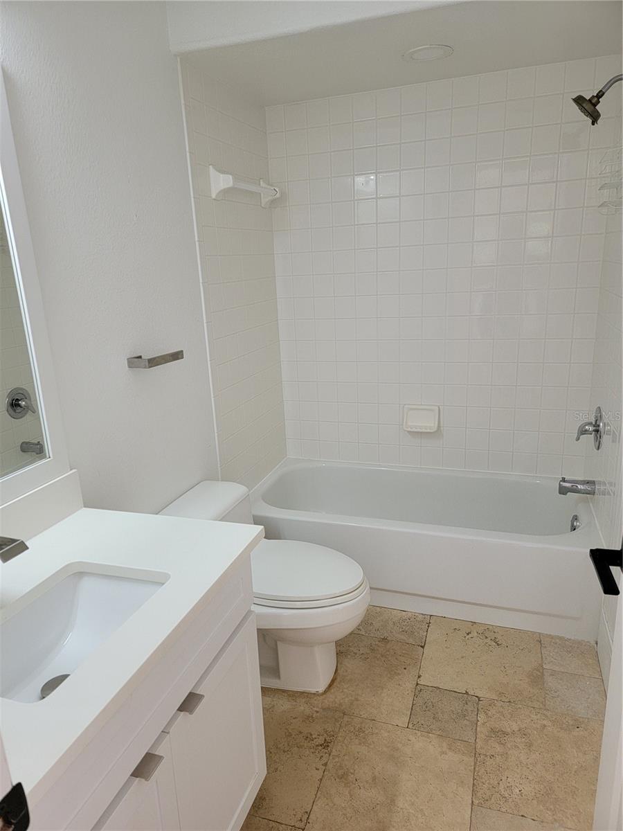 Second bathroom with tub and shower