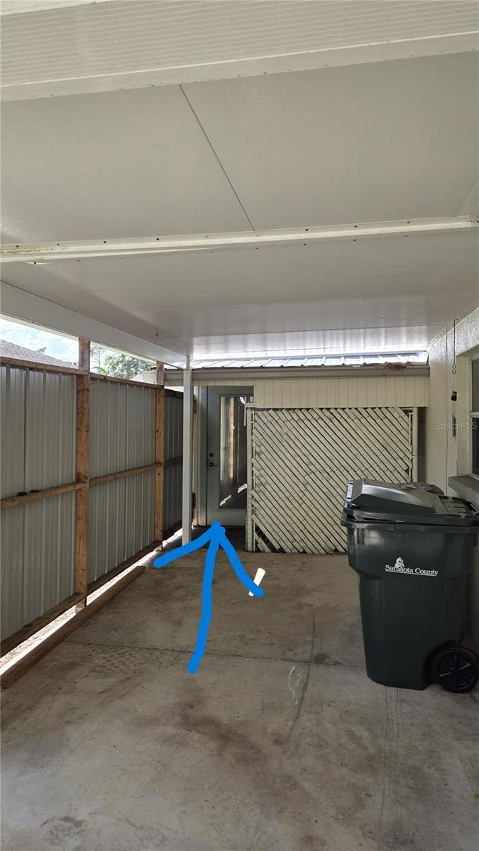 Outside entrance through carport to Apt 4
