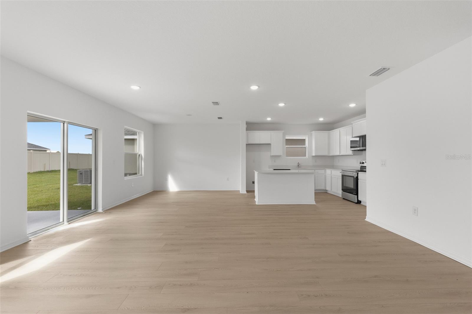 Open concept living, dining, and kitchen
