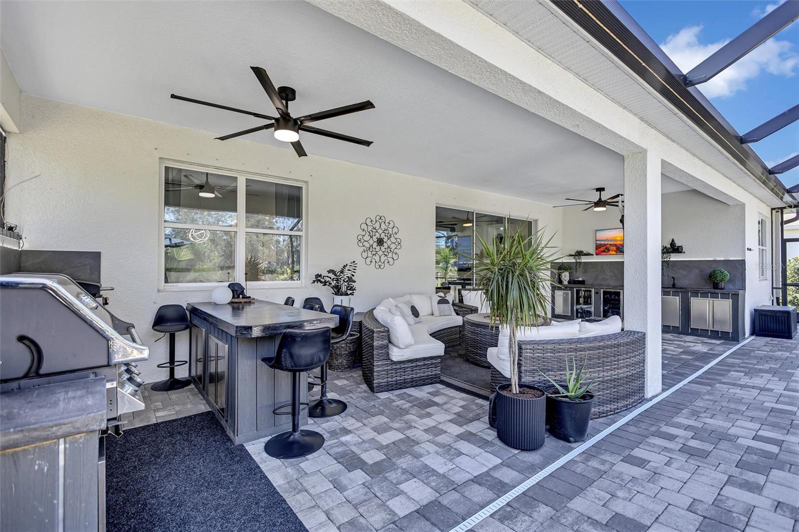 Sit out here all year long with a South Facing Lanai!  Shade!