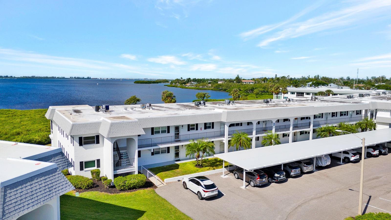 Front of condo with bay behind
