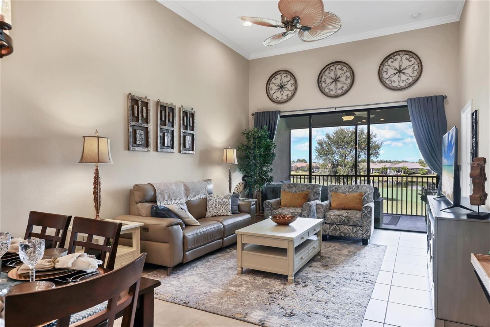Living room with vaulted ceiling, and large sliders to a Gorgeous View!