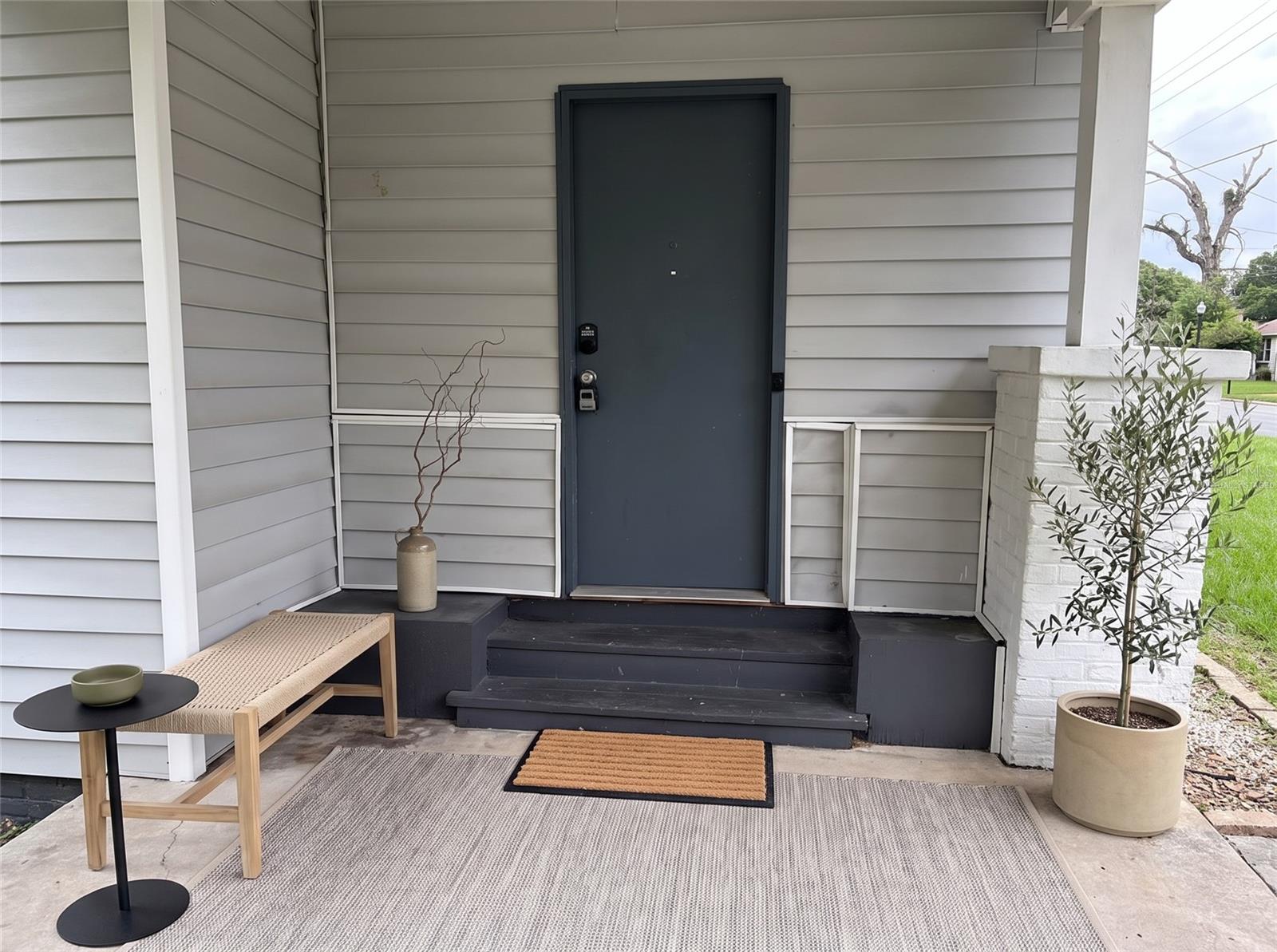 Front door from carport"Virtually staged"
