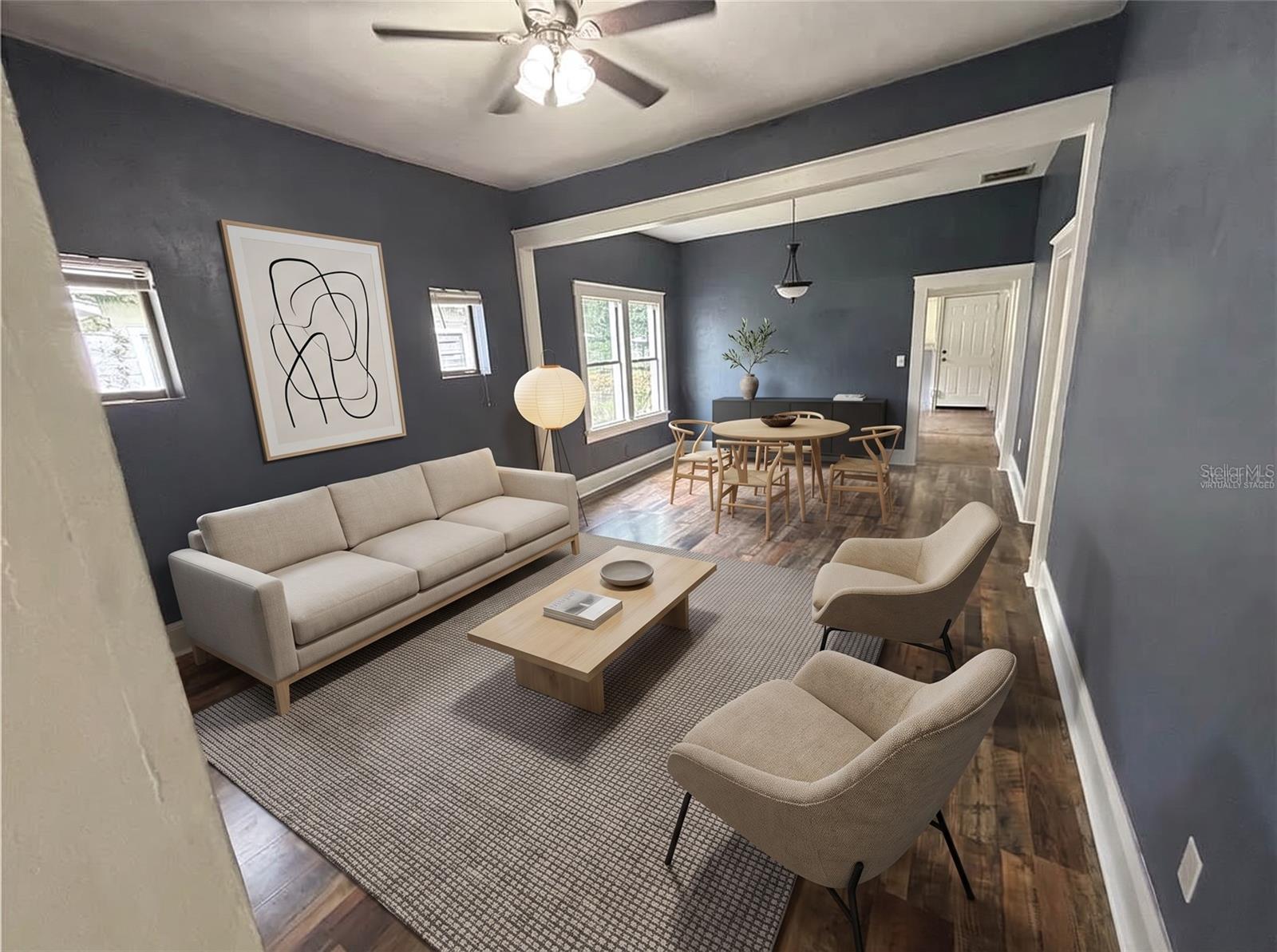 Living/dining room looking toward rear of house "Virtually staged"