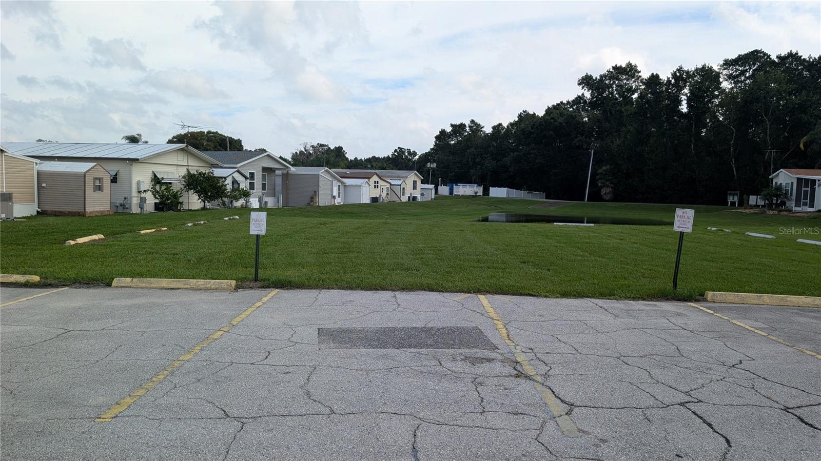 OVER LOOKING REAR OF HOUSE (WHITE SHED IN MIDDLE)