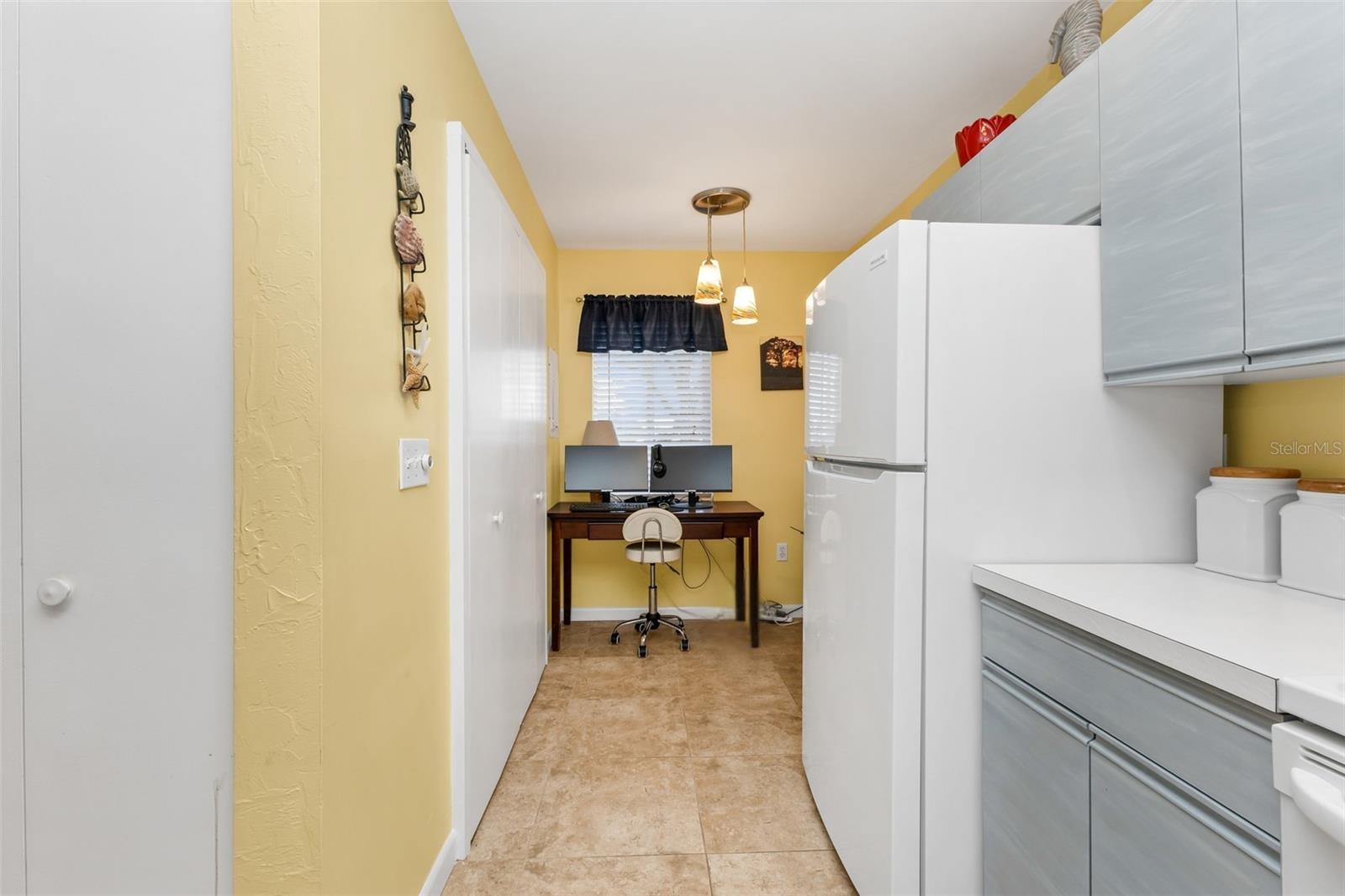 Bonus flex space just off the kitchen adds unexpected versatilitycurrently used as a home office, with possibilities for a hobby area, additional pantry/storage, or household command center. In-unit laundry is conveniently located nearby.