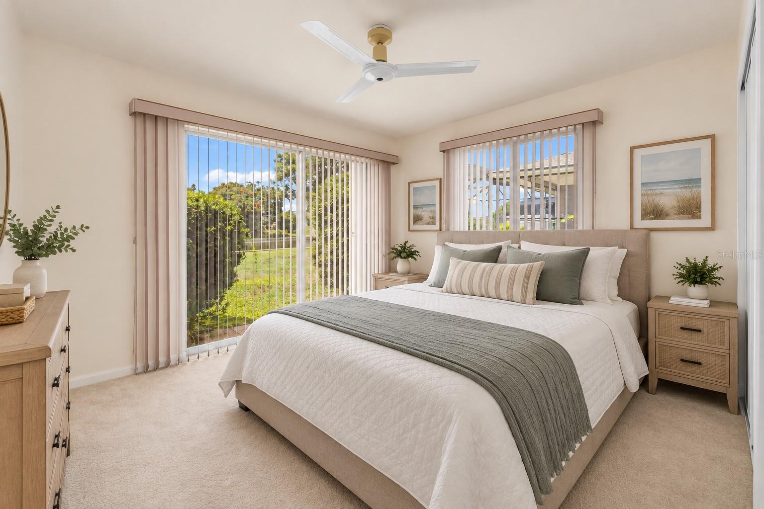 Bedroom 3 staged as a bedroom with a waterfront view.