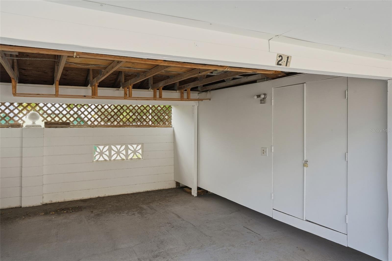 Garage with closet and overhead storage