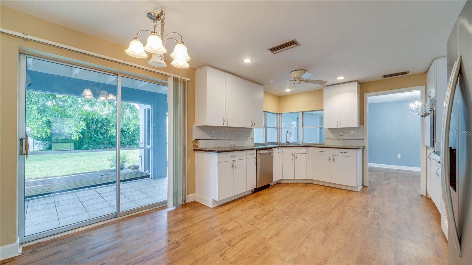 Eat-in kitchen with lanai access.