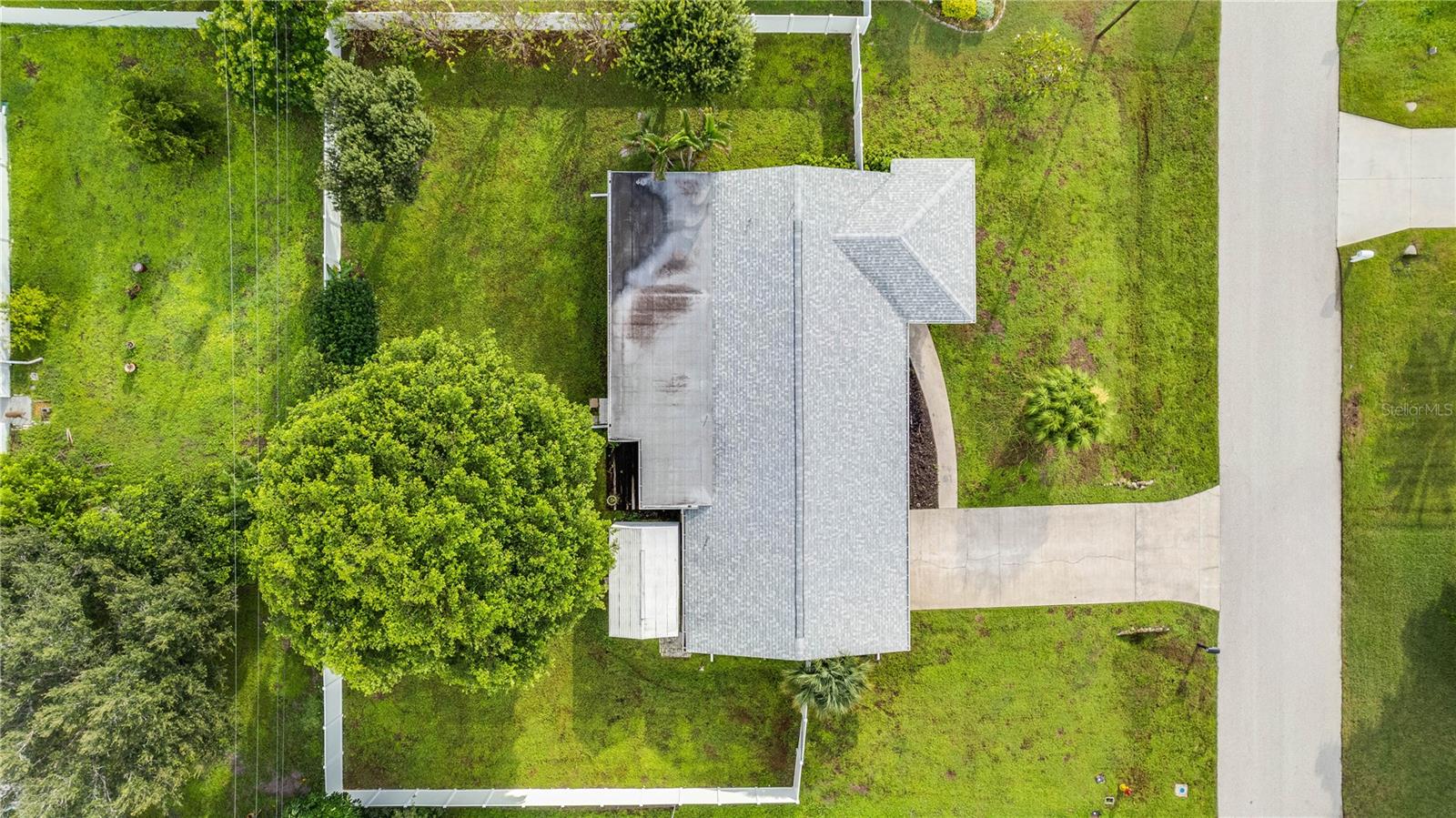 This home is perfectly positioned on a triple lot providing privacy and room for a pool.