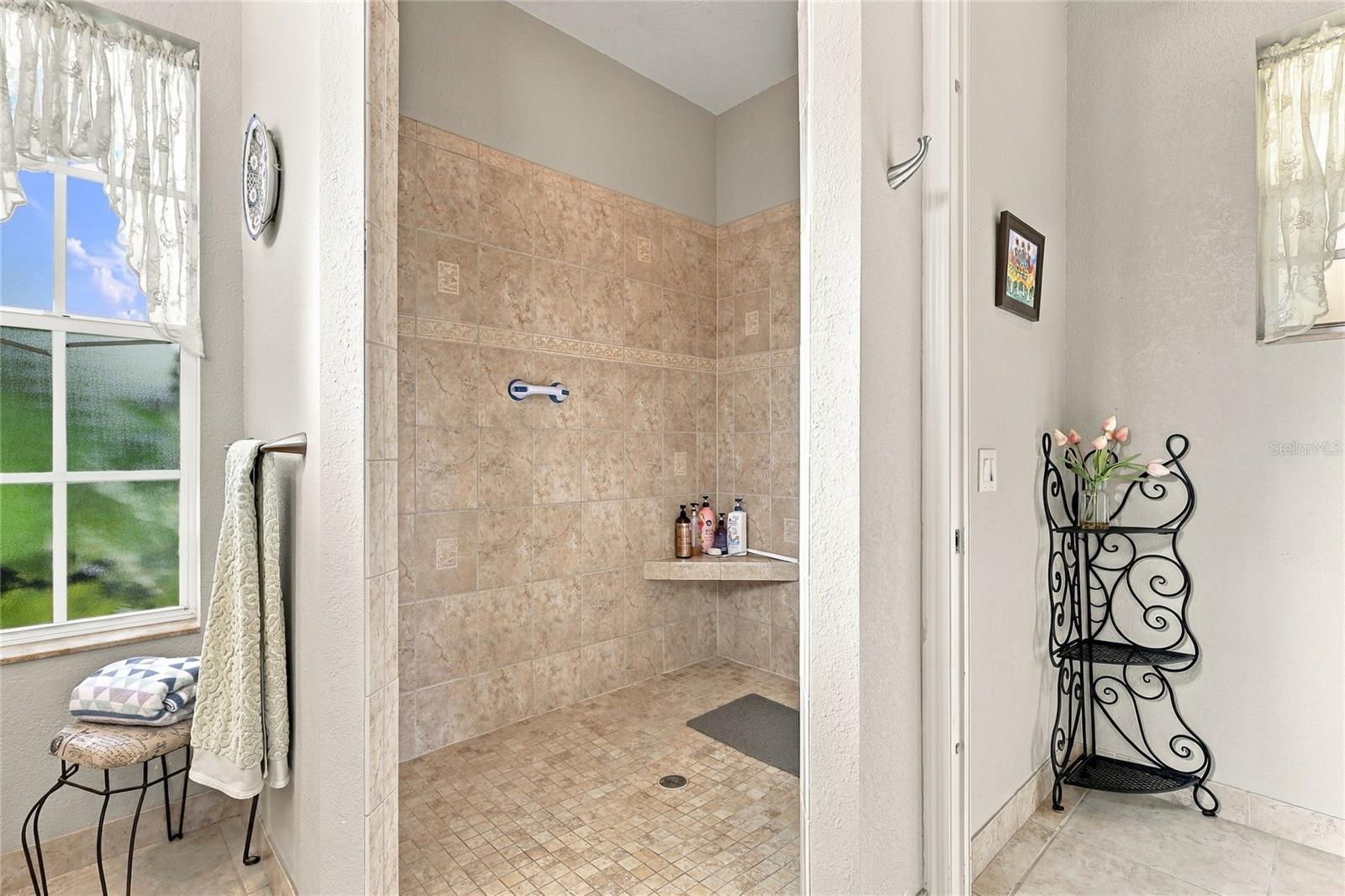 M bath has huge walking shower and separate WC
