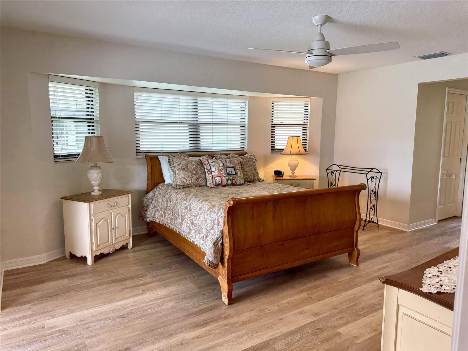 Primary bedroom with bay windows