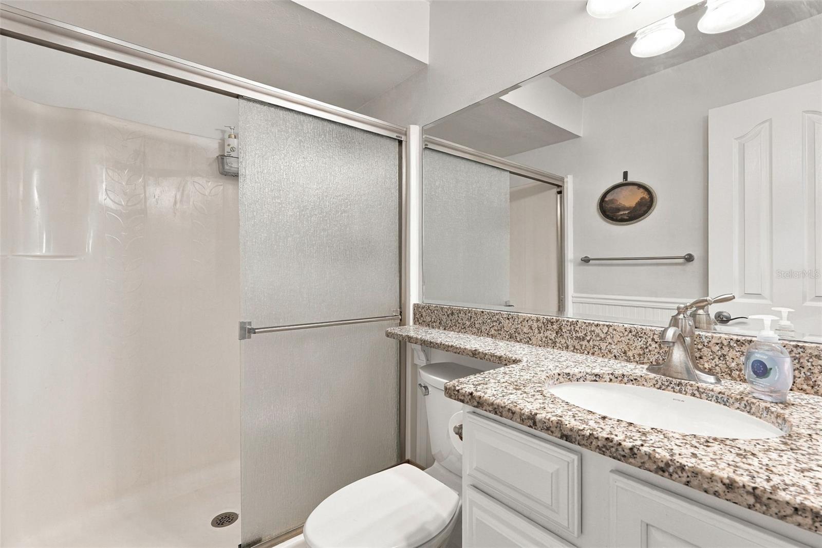 Spacious Walk-In Shower with Granite Top Vanity Spacious Walk-In Shower with Granite Top Vanity