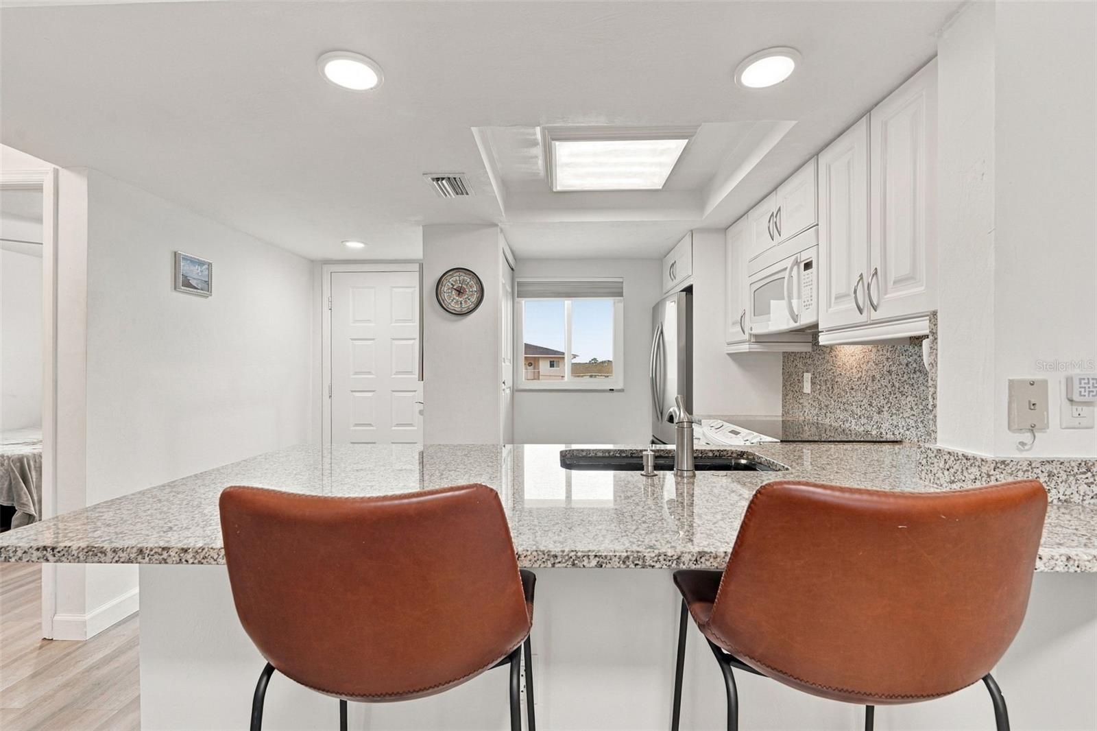 Breakfast Bar with Pass Through Opening to Kitchen Breakfast Bar with Pass Through Opening to Kitchen