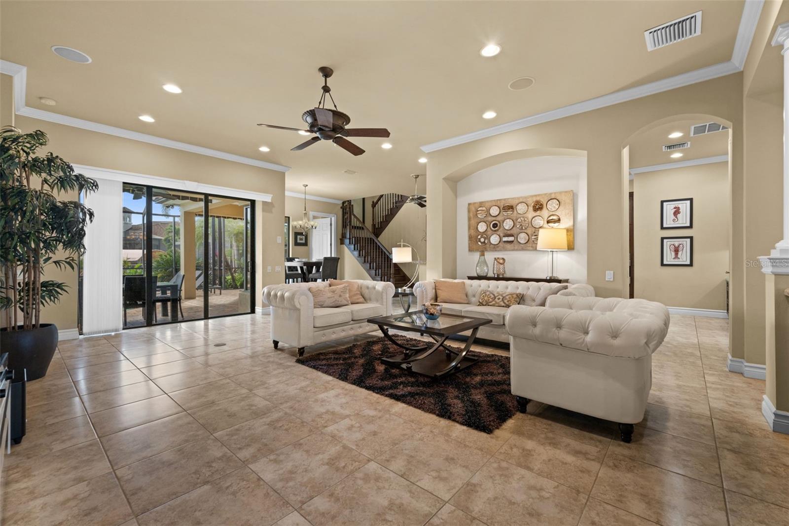Grand open great room looking toward the pool
