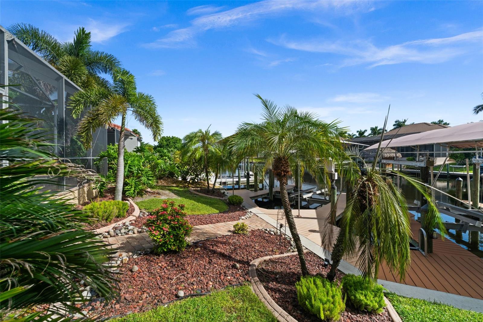 Beautiful tropical landscaping in the backyard too